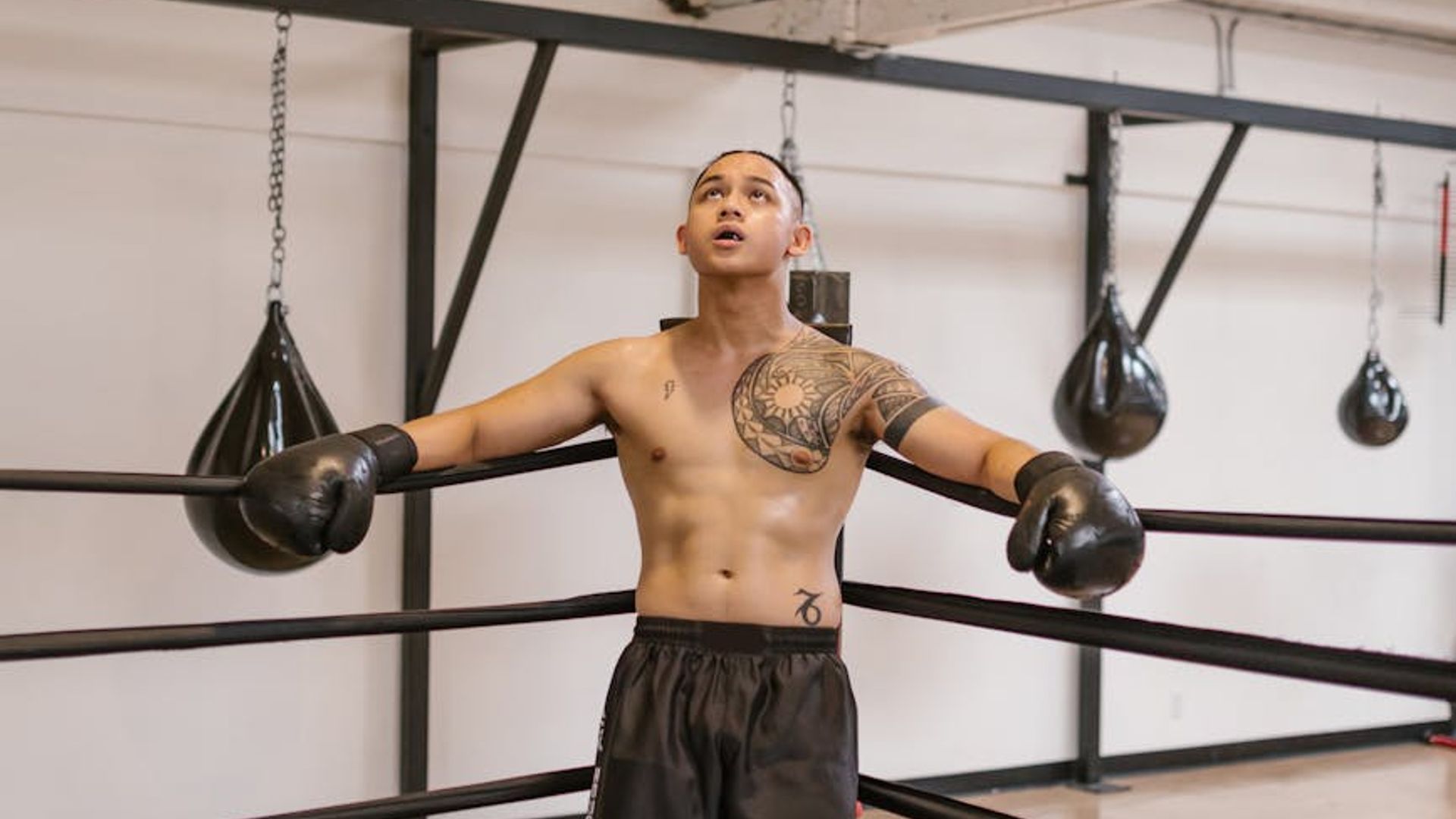 Determined man preparing for a workout session in a modern gym setting